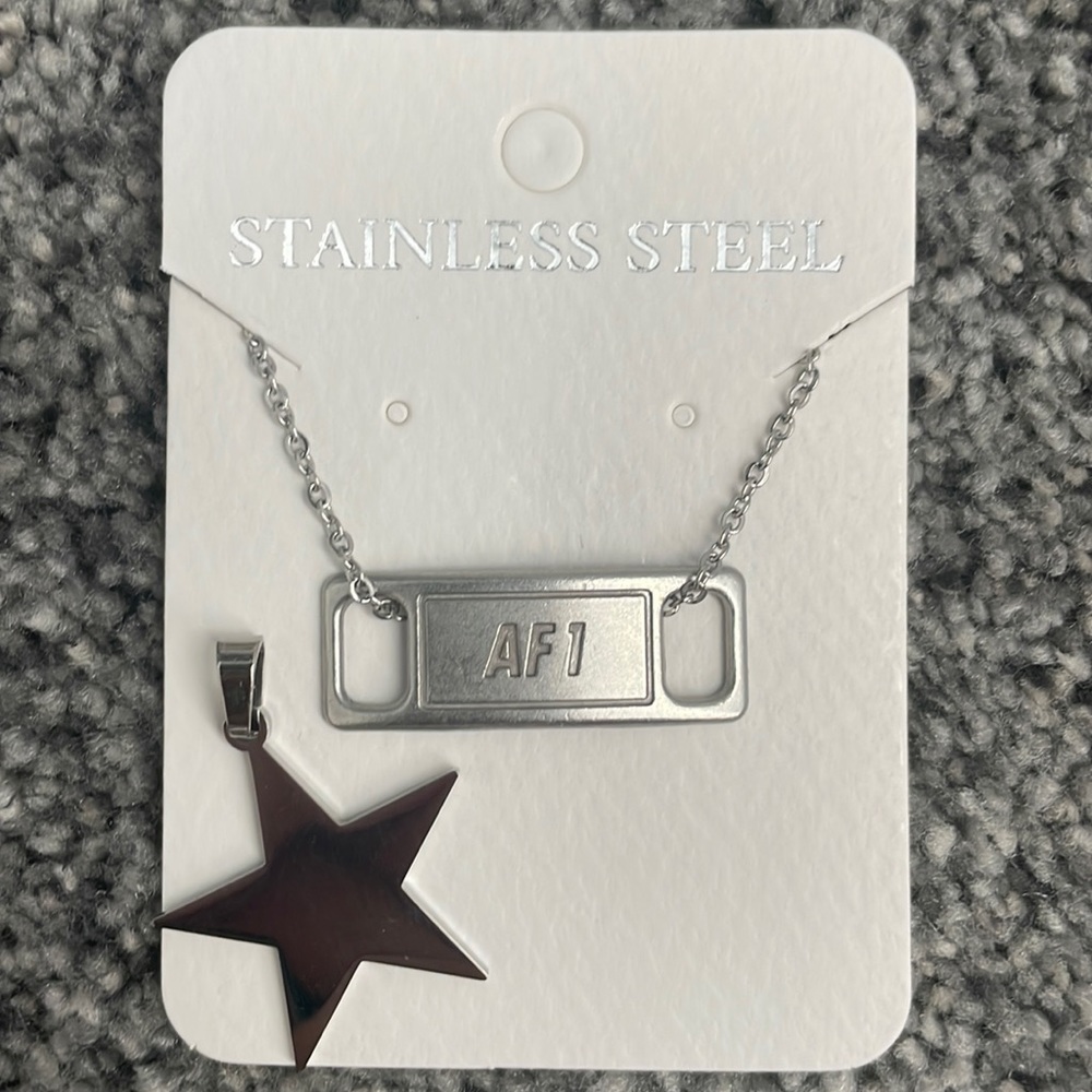 Men and woman’s air force one stainless steel necklace. With star charm